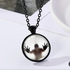 Shadow Person Inside A Pendant, Black Chain, Glows in the Dark